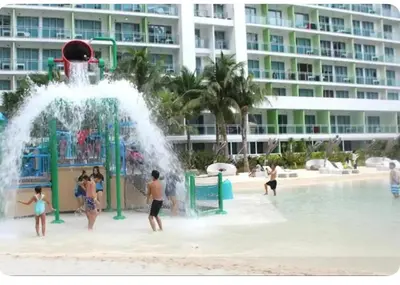 a group of people playing in a water park at 2BR Cozy Condo at Azure Urban Resort Residences by Gigi in Manila