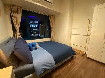 a bedroom with a large bed with a window at Air Residence 1BR Condo with City View in Manila