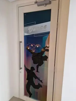 a door with a painting of two people on it at Modern & New, Work Desk, Fast Internet, Balcony in Manila