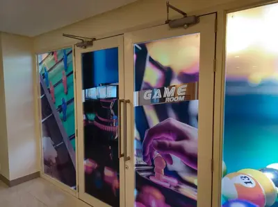 a closet with glass doors with a game room at Modern & New, Work Desk, Fast Internet, Balcony in Manila