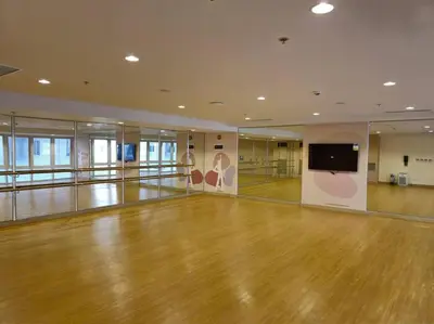 a bowling alley with a wooden floor and a flat screen tv at Modern & New, Work Desk, Fast Internet, Balcony in Manila