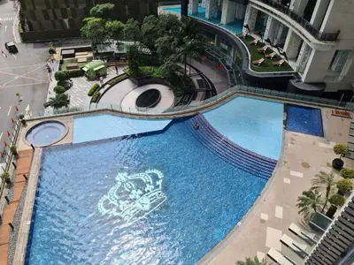 an overhead view of a large swimming pool in a building at Scandi Inspired Studio in Knightsbridge, Makati in Manila