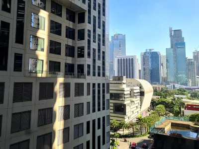 a view of a tall building in a city at Scandi Inspired Studio in Knightsbridge, Makati in Manila