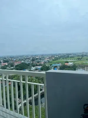 a view of a city from a balcony at Entire unit with balcony at SMDC Field Residences, behind Sucat near NAIA in Manila
