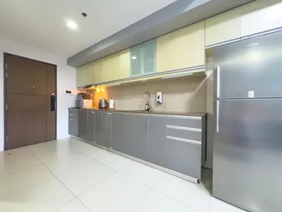 a kitchen with stainless steel cabinets and a sink at 1BR BGC, One Uptown Residence B001 in Manila