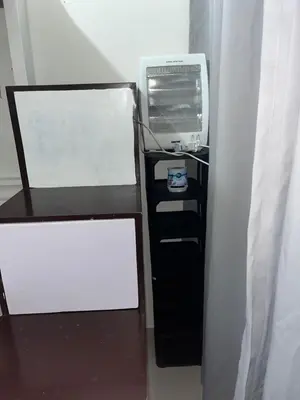 a desk with a computer on top of it at Chill in Peace Staycation 2BR condo at Field Residences, Sucat near NAIA in Manila