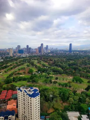 an aerial view of a city with tall buildings at Bigg Apol Suite in Manila