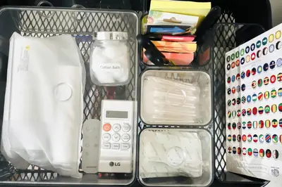 a plastic container filled with different types of items at NEW! Studio Condo in Prisma Residences Pasig in Manila