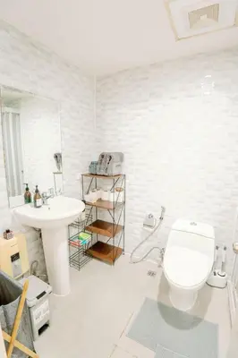a bathroom with a toilet and a sink at Spacious 2BR at SoMa BGC Near SM Aura and Bonifacio High Street in Manila