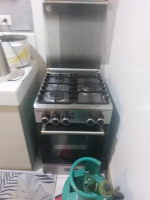 a stove in a kitchen with a teapot at Florida sun estates condo in General Trias