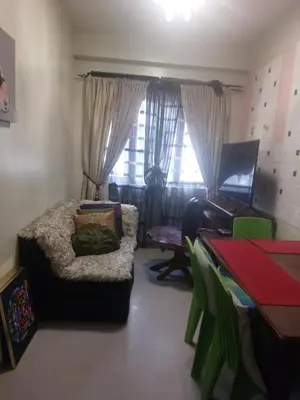 a living room with a couch and a piano at Florida sun estates condo in General Trias