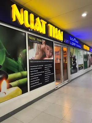 a sign for a nhat mine in a mall at Sea Residences MOA Manila By Paul XIVI in Manila