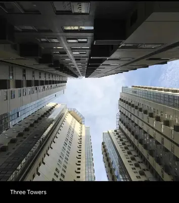 two tall buildings are looking up into the sky at Fort Victoria Condominium Tower C in Manila