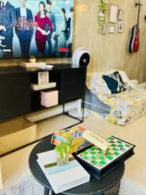 a coffee table in a living room with a table sidx sidx at Luxurious Viceroy Residence Walk to Venice Grand Canal in Manila