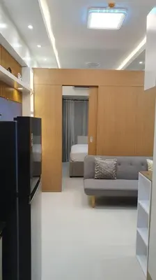 a living room with a couch and a bed at Red Residence Makati-Cozy Condo Unit with Balcony in Manila