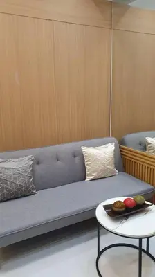 a living room with a couch and a table at Red Residence Makati-Cozy Condo Unit with Balcony in Manila
