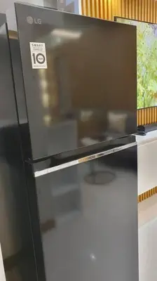 a black refrigerator with a sticker on the front of it at Red Residence Makati-Cozy Condo Unit with Balcony in Manila
