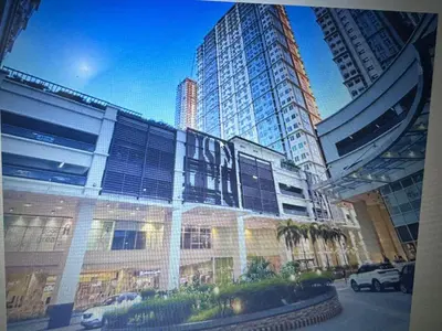 a view of a building in a city with tall buildings at Marty's Turf at San Lorenzo in Manila