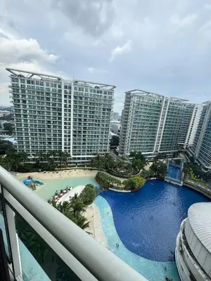 a view of a resort with tall buildings at Royale One Five Azure Staycation in Manila