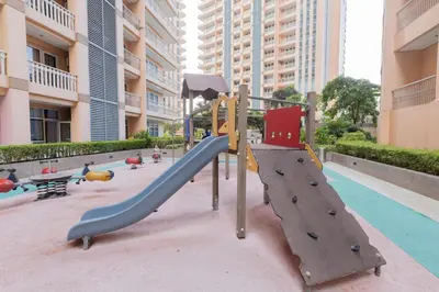 a playground with two slides in a building at LUXX BGC Venice in Manila