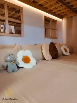 a group of stuffed animals sitting on a couch at El Nissi Staycation, The Play Cabin, Beside Enchanted Kingdom in Santa Rosa