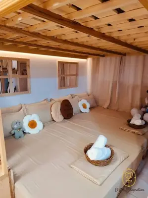 a living room with stuffed animals on a couch at El Nissi Staycation, The Play Cabin, Beside Enchanted Kingdom in Santa Rosa