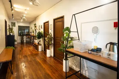 a hallway with potted plants in a room at Homey and Cozey Poblacion Makati S09 in Manila