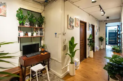 an office with a desk with a computer and plants at Homey and Cozey Poblacion Makati S10 in Manila