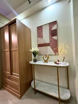 a bathroom with a sink and a mirror at Santa Place Shore Residences Tower A in Manila