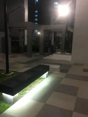 a night view of a building with lights on the ground at A & Y Staycation in Manila