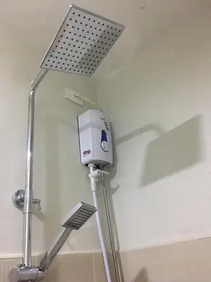 a machine on the corner of a room at A & Y Staycation in Manila