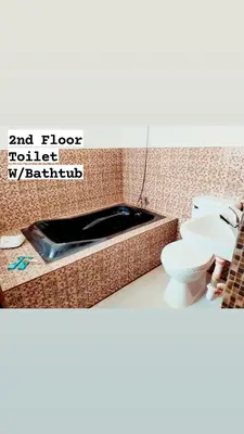 a bathroom with a sink and a toilet on a counter at Family Airconditioned Room with Balcony & Parking in Cabuyao 2-storey house in Cabuyao