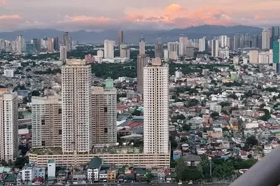 a view of a city with tall buildings at Amazing 1 bedroom with pool, gym and stunning view at heart of Makati in Manila