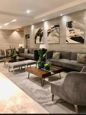 a large living room with couches and tables at Natalie's Place in Mall of Asia Complex in Manila