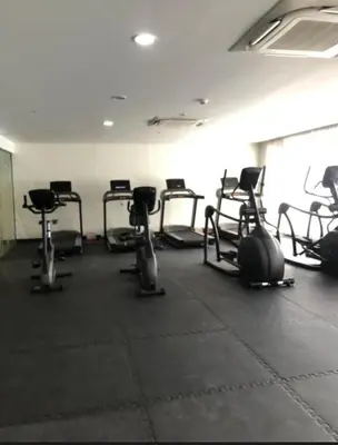 a room with a bunch of exercise bikes in it at Natalie's Place in Mall of Asia Complex in Manila