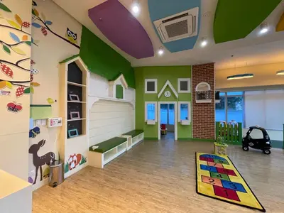 a childs room with green and white walls at Cozy 1 bedroom condo in Uptown BGC in Manila