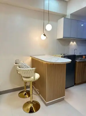 a kitchen with a counter and a chair in a room at Haiya's Staycation Aesthetic & Cozy in Tagaytay in Biluso