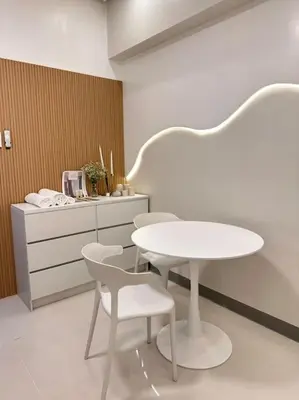 a white table and chairs in a room at Haiya's Staycation Aesthetic & Cozy in Tagaytay in Biluso