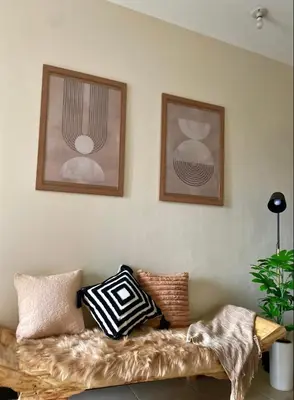 a couch with pillows on it in a living room at Luxury Bauhaus inspired apartment near Makati in Manila