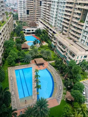 an overhead view of a large swimming pool in a city at Luxury Bauhaus inspired apartment near Makati in Manila