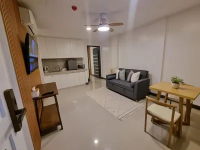 a living room with a couch and a table at Flat 35, Unit 2A in Manila