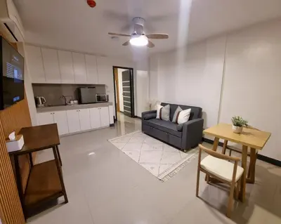 a living room with a couch and a table at Flat 35, Unit 2A in Manila