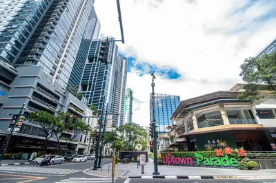 a city street with tall buildings and a street light at Luxury 120sqm suite Uptown BGC with spectacular balcony view in Manila