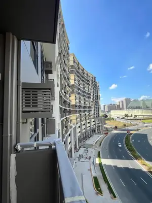 a view from a balcony of a building with a road at GENTRY MANOR fast WiFi,Balcony near Okada,MOA&NAIA 8Q in Manila