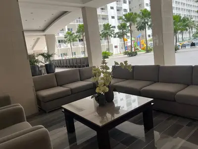 a living room with couches and a coffee table at Budget SHORE Family Suite 2 Bed WiFi Netflix MOA844 in Manila