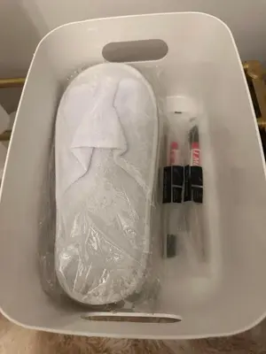 a white refrigerator with a ham in a plastic container at Elyana's Staycation in Pasalada