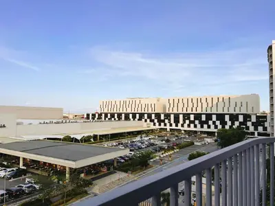 a view of a building with a parking lot at 2br condo in Southmall Las Pinas 25 mins to NAIA - 709T3 in Manila