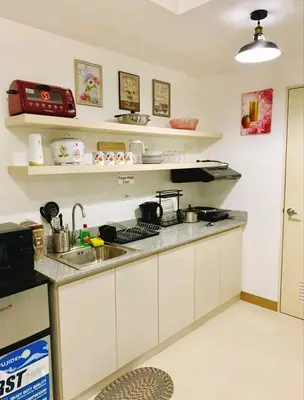 a kitchen with a sink and a counter top at 2br condo in Southmall Las Pinas 25 mins to NAIA - 709T3 in Manila