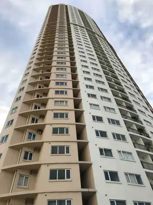 a tall building with many windows on it at 2-Bedroom Condo with Swimming Pool in Manila
