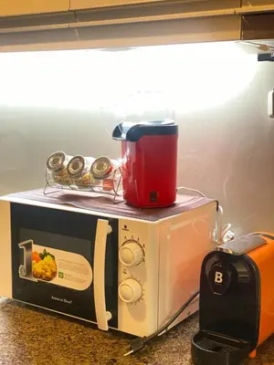 a toaster sitting on top of a box on a counter at Stylish and relaxing studio unit in Manila
